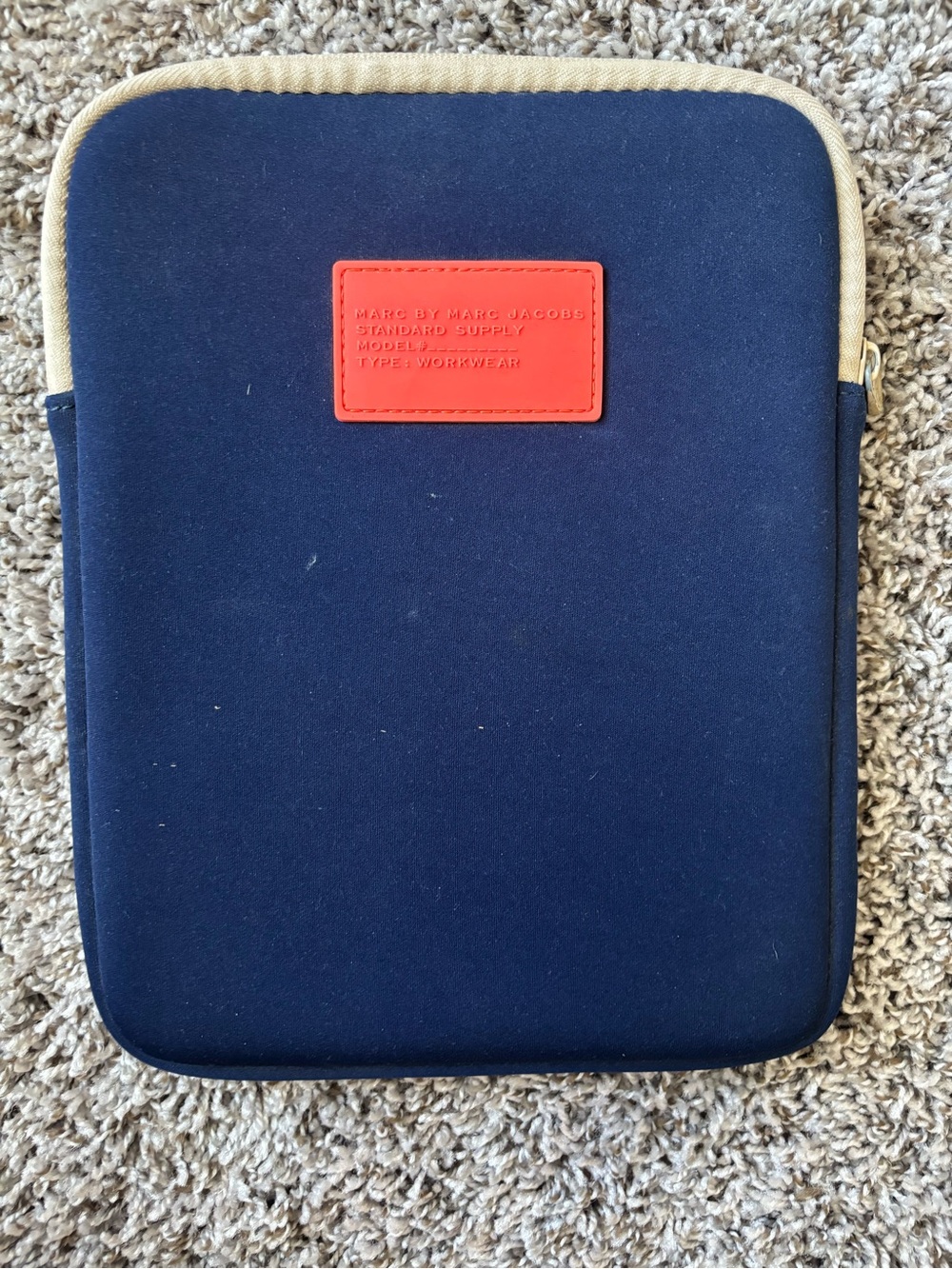 Marc by Marc Jacobs navy case with coral logo patch